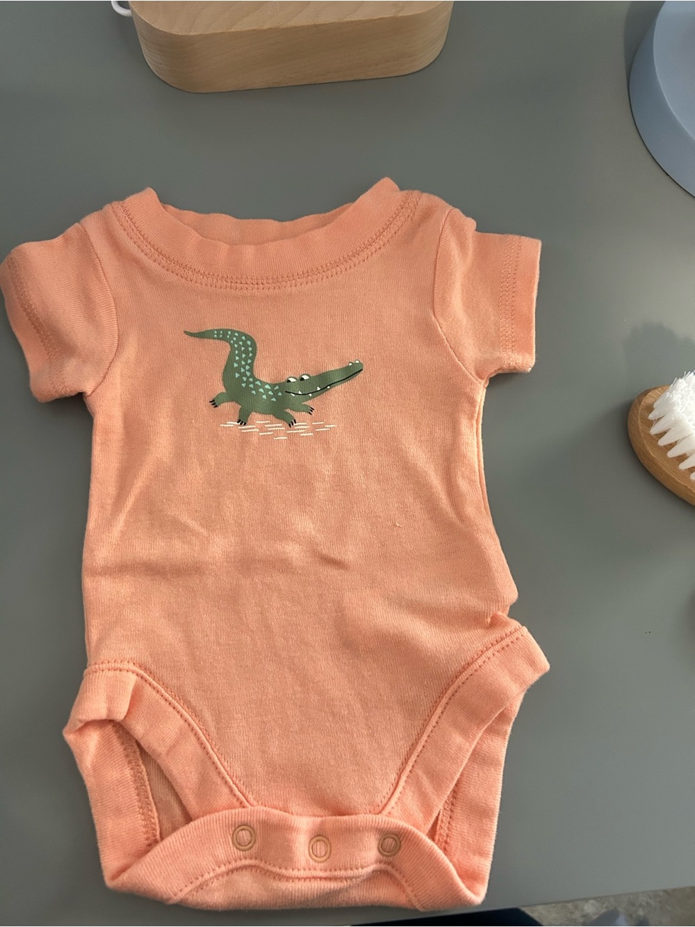 Children’s Place Newborn Orange Alligator Onesie
